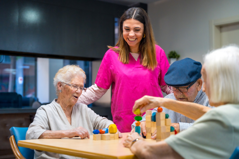 Aged care residents enjoying group lifestyle activities with a trained student volunteer from UniMinistry Foundation